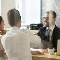 cybersecurity expert discussing the most targeted industries for cyber attacks with clients