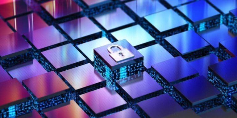 cube with a lock image as metaphor for cybersecurity insurance|man performing cybersecurity on his computer