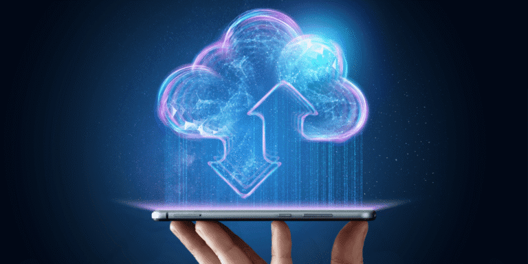 hand holding a smartphone with a computer-generated cloud above it|man working on his computer at his desk