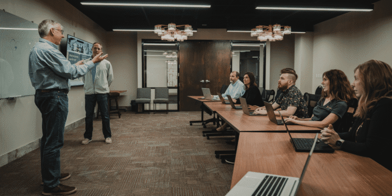 real business of IT how cios create and communicate value|Text saying Communicate IT Business Value with people talking below