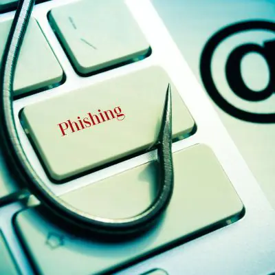 fish hook on a computer keyboard with an @ sign